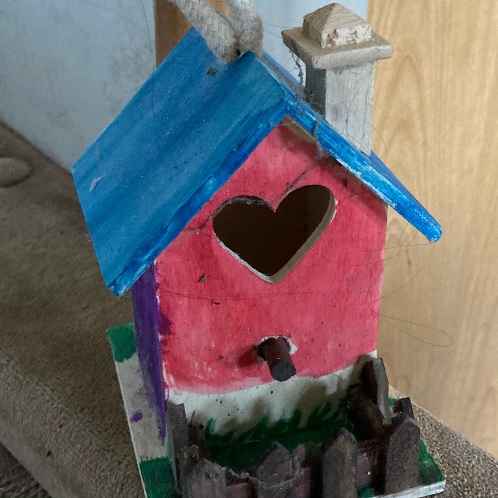 Bird House that is painted in a few different colors